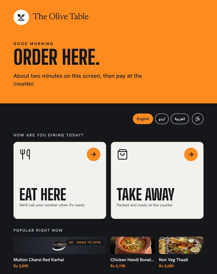 The kiosk welcome screen: Order here, choose Eat here or Take away, language buttons and a Popular right now row
